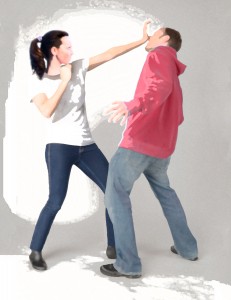 Woman defending herself against a male attacker